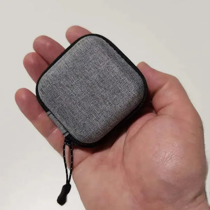 Shockproof Headphone Storage Bag held in a hand, showcasing its compact and protective design.