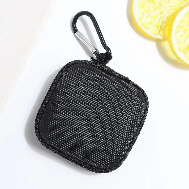Shockproof Headphone Storage Bag with zipper and carabiner, perfect for protecting headphones on the go.